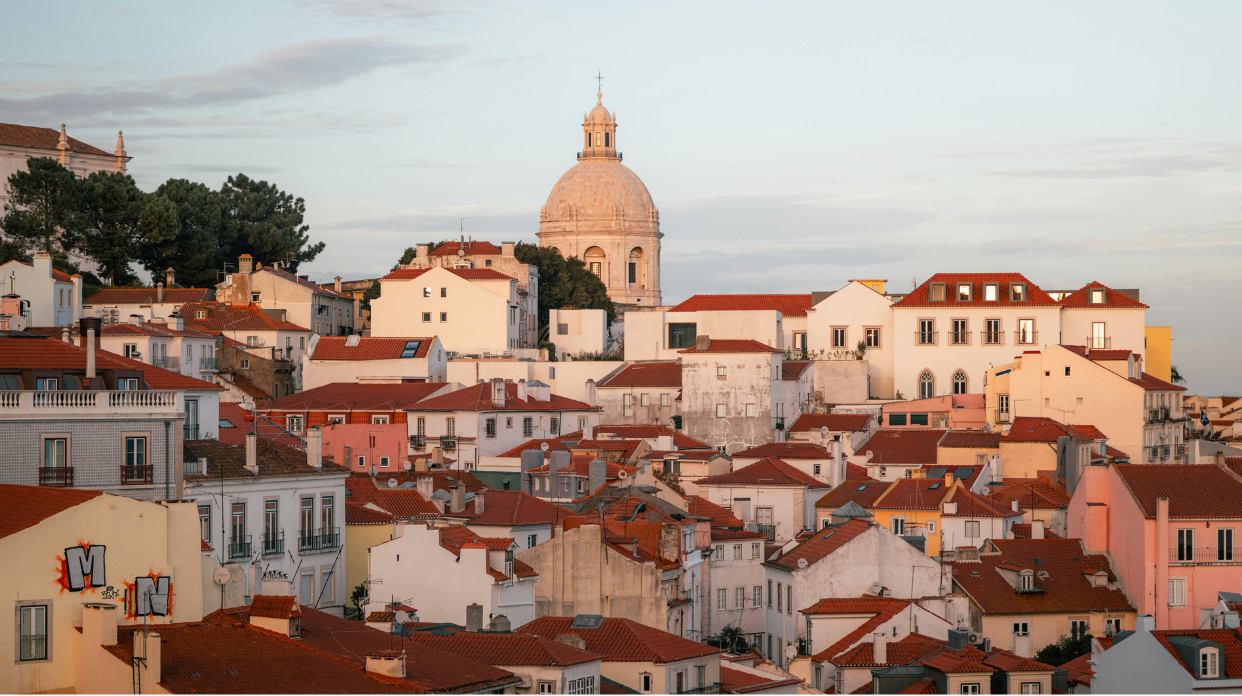 Lisbon rooftops and the Pantheon dome at golden hour